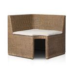Three-quarter view showing woven rattan texture and beige cushion of Senna Woven Dining Bench