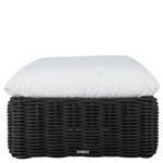 Woven ottoman with white cushion shown from front angle highlighting woven label on base