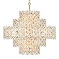 Neutral-lit chandelier emphasizing flower clusters and gold metal elements