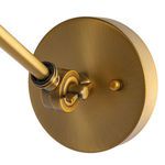 Close-up on brass wall mount plate and adjustment joint knob with brushed finish
