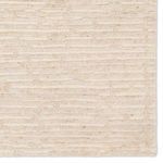 Detailed view of rug pattern and soft texture focusing on edge and striped design