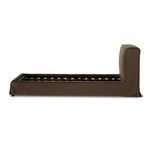 Close-up of plump headboard corner with smooth coffee brown linen slipcover fabric