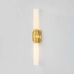 Illuminated Glen Oaks Wall Sconce showing warm glow of seedy opal glass cylinders