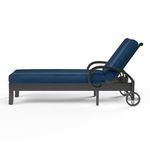 Side profile view of Monterey Chaise Lounge showing adjustable backrest raised and dark blue cushion