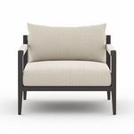 Close front angle emphasizing textured upholstery and clean frame edges