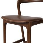 Detailed angle of front corner showing rounded seat edges and leg joints
