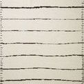Roman Ivory Black Rug with neutral ivory background and irregular thin black horizontal stripes with stitched black edges