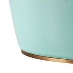Close-up of the lamp base showing glossy glazed ceramic and brass top detail