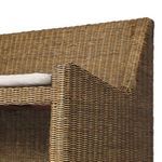 Close-up of corner armrest showing smooth rattan weaving and fabric cushion edge