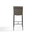 Straight rear view highlighting smooth taupe leather backrest and iron legs