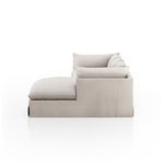 Side profile of left arm-facing sectional showing cushion layering and fabric texture