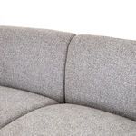 Close-up of curved backrest upholstery seam where two sectional pieces meet