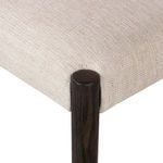 Upholstery detail showing seamless fabric wrapping around corner of seat cushion