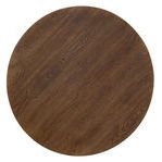 top-down view of round wooden dining table showcasing wood grain texture in worn saddle finish