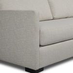 Close-up on squared armrest area illustrating fabric texture and stitching details