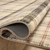 Rug folded back showing soft padded underside and thickness