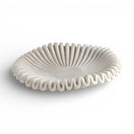 White marble bowl with smooth finish and soft ruffled edges, shallow and round with sculptural charm