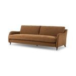 Lynne Sofa showing angled view highlighting curved armrest and tapered rear legs.