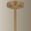 Close-up of round patina brass ceiling mount and rod supporting the pendant light