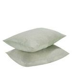 Two shams stacked highlighting fabric texture and soft sage color