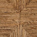 Close-up texture of tightly woven banana leaf basketweave seat