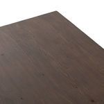 Top-down view of the wood grain on the desk's surface showing color and texture