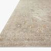 Close-up angled view showing woven texture and edge detail of ivory and beige Rosemarie rug