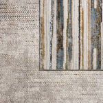 Overlay comparison showing Sylvana Trellis rug’s lighter border and pattern contrast with a striped rug
