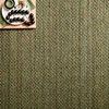 Close-up of Lily Green Rug showing intricate woven texture with decorative beads and a small tray.