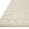 Close-up angled edge view highlighting the pile texture and wool tufting detail of the ivory Cecelia Mist rug