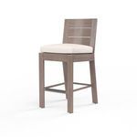 Laguna Barstool with hand-brushed aluminum frame mimicking driftwood and a light beige cushioned seat