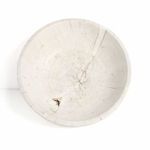 Top-down view emphasizing bowl’s circular shape and irregular wood grain patterns