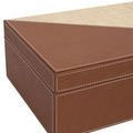 Close-up showing corner angle and detailed white stitching on leather box
