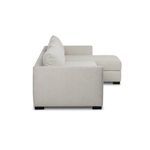 Side profile highlights low arm height and plush cushions of the sectional