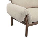 Close-up of ruched and tied fabric detail on chair arm with dark wood leg