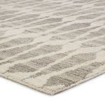 Hand-knotted area rug with a bold geometric Moroccan pattern in ivory and light gray plush wool