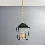Natick aged brass lantern pendant hanging in room with light gray wall background