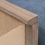 Close-up of the woven natural fiber detail on the wooden side panel, showing craftsmanship