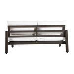 Straight back view of sofa with two large white cushions and framed aluminum slats