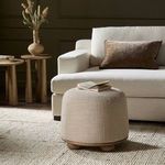 Bilbury Ottoman styled in living room with beige sofa, pillows, side tables, and neutral rug