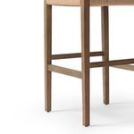 Lower portion of stool showing solid oak legs and crossbeam footrest