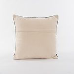 Back view showing plain beige fabric with a horizontal closure flap on the pillows