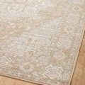 Angled close-up of another rug corner showing detailed border pattern and texture against wooden floor