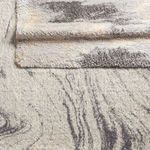 Stacked rugs showing layered thickness and soft texture of the Triton Abstract modern area rug