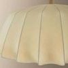 Close-up of the Flinders pendant showing textured folds and fabric detail of the shade