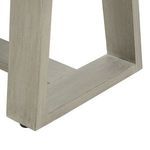 Reverse angle of trapezoidal leg base focusing on joinery and wood grain