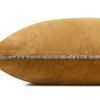 Side view showing the pillow’s velvet texture and narrow piped edges