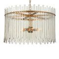 Front shot of chandelier with clear, straight glass bars and warm antique brass frame hanging by chain