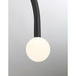 Close-up of single glowing white opal glass orb attached to curved matte black arm