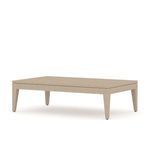 Solid teak outdoor coffee table in washed brown finish with rectangular slatted top and angled legs.